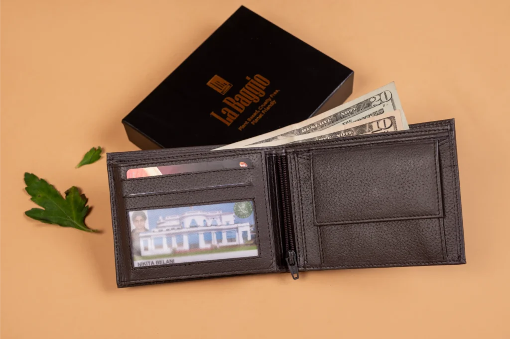 Black vegan leather wallet for men with money and card on a beige background