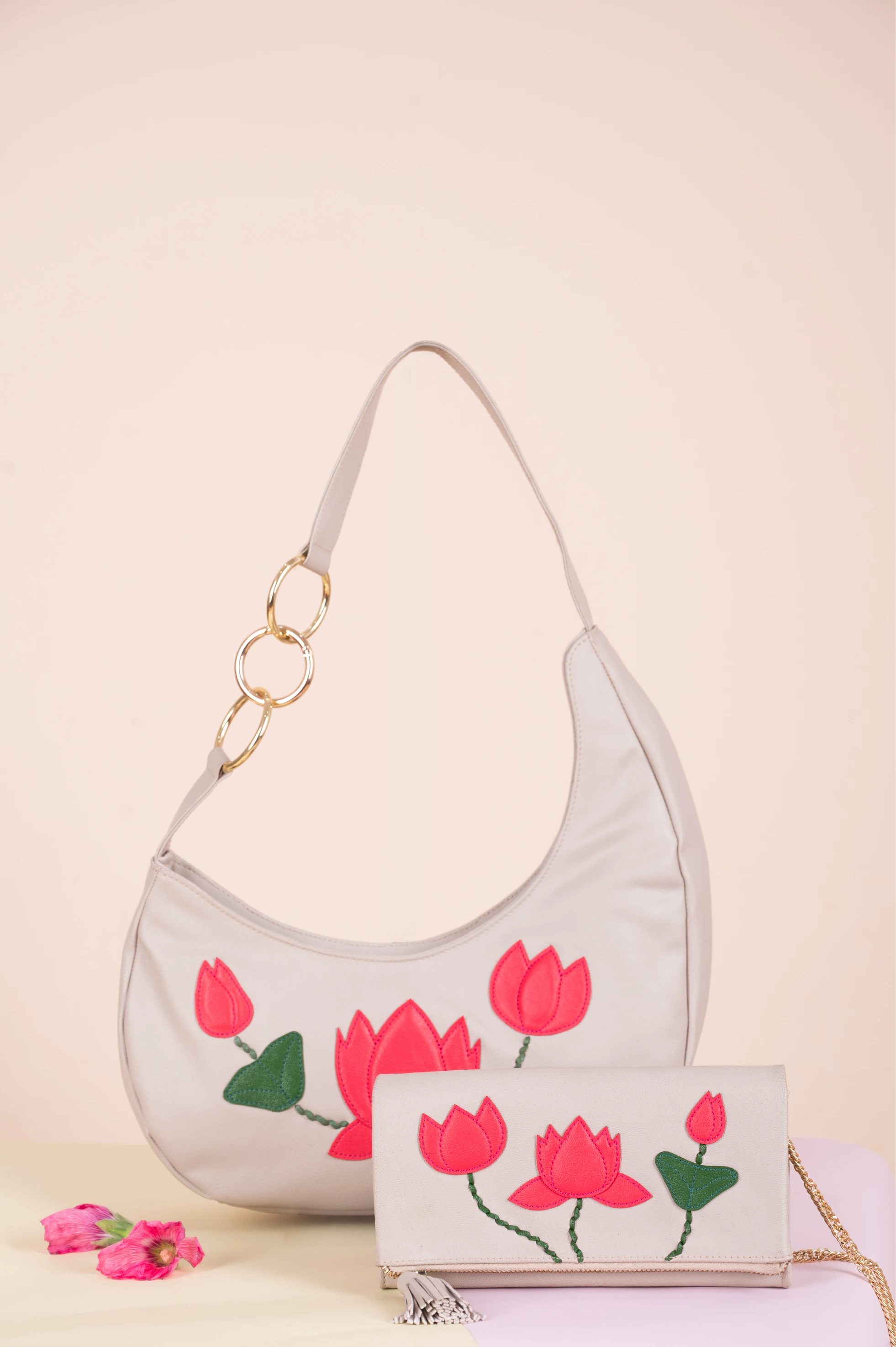 White vegan leather handbag for women with floral design on a light pink background