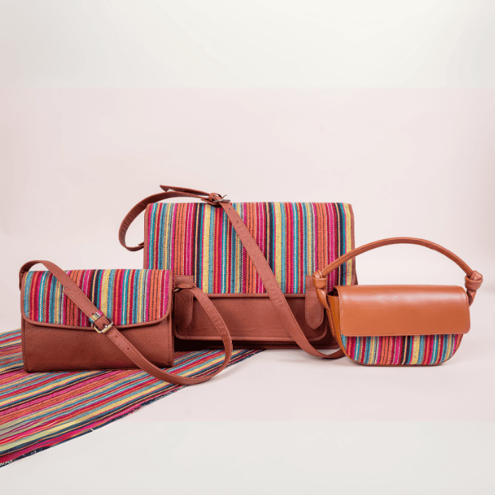 Set of vegan leather bags for women with striped fabric and brown leather accents on a light background
