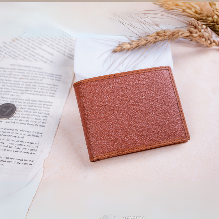 Brown vegan leather wallet for men on an open book with wheat stalks